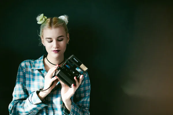 Studio portrait of a girl with retro camera — Stock Photo, Image