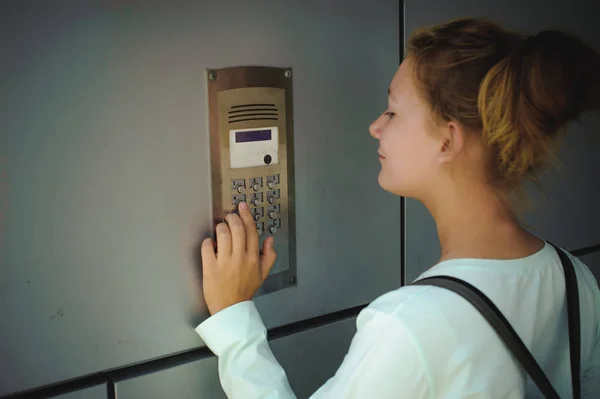 Young Blond Teenager Schoolgirl Dials Code Call Intercom — Stock Photo, Image