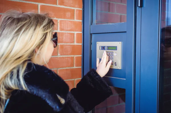 Young Blond Woman Fur Coat Dials Code Doorphone Panel Presses — Stock Photo, Image