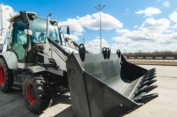 Excavator Loader Machine. Side View of Front Hoe Loader. Industrial Vehicle. Heavy Equipment Machine. Pneumatic Truck. Construction Equipment