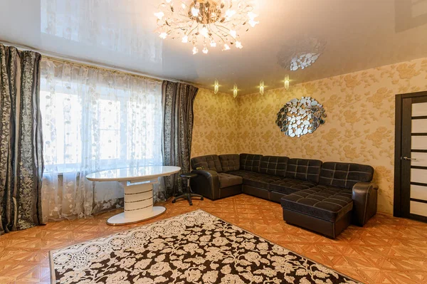 Russia, Moscow- September 10, 2019: interior room apartment modern bright cozy atmosphere. general cleaning, home decoration, preparation of house for sale. chandelier, carpet, sofa