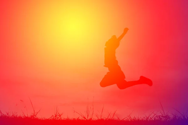 Silhouette a girl playing on sunset,happy time on holiday, vintage tone — Stock Photo, Image