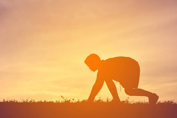 Silhouette a boy running on sunset — Stock Photo, Image