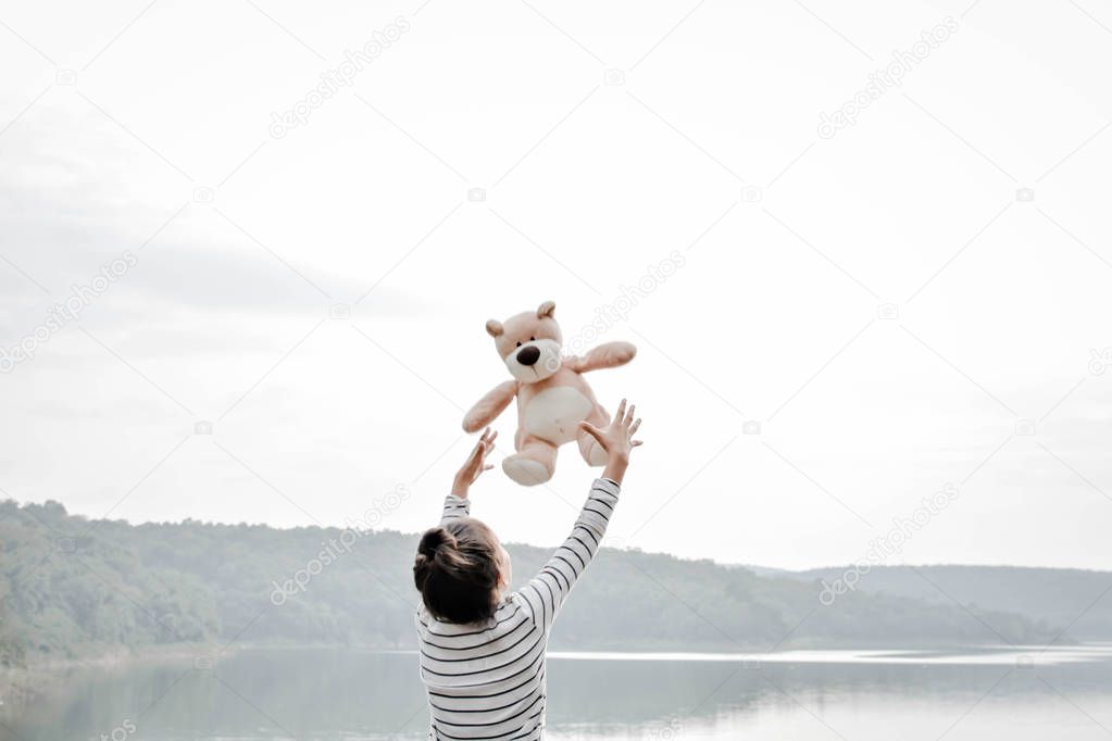 Happy asian children with teddy bear in nature ,relax time on holiday