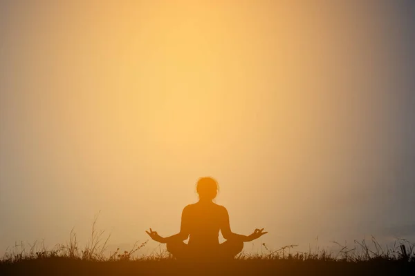 Silhouette women yoga in nature