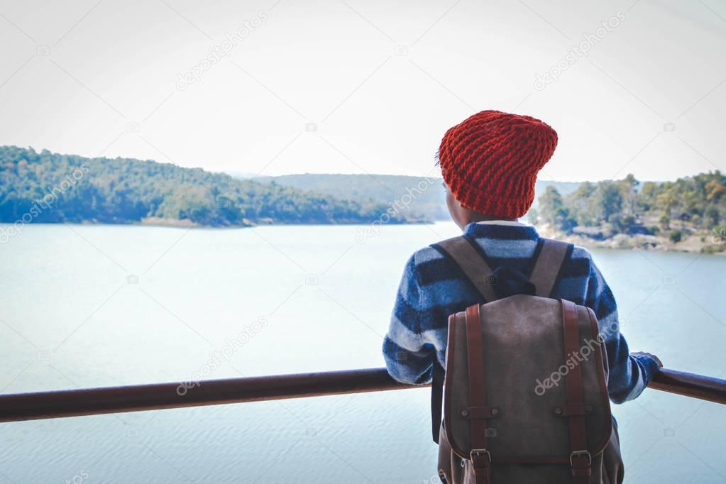 Happy Asian boy backpack in nature background