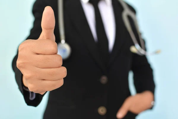 Portrait of women doctor thumbs up with stethoscope on blue — Stock Photo, Image