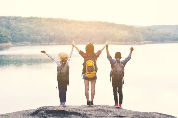 Happy Asian people backpack in nature background — Stock Photo, Image