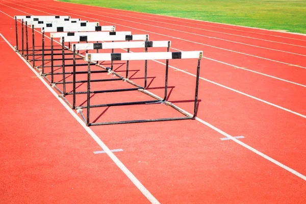 hurdle race on stadium track