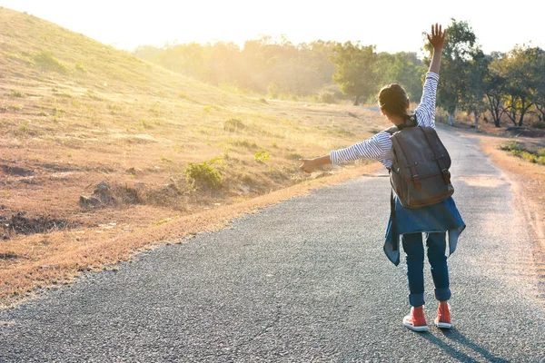 Happy Asian girl backpack  in nature background — Stock Photo, Image