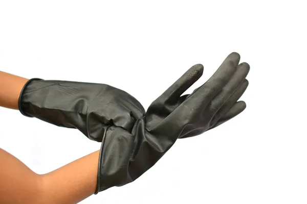 Manos y guantes negros para la agricultura sobre fondo blanco —  Fotos de Stock
