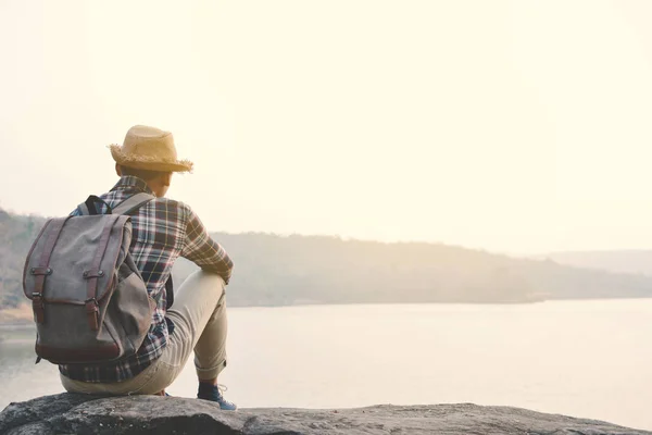 Happy Asian hipster man backpack in nature background — Stock Photo, Image