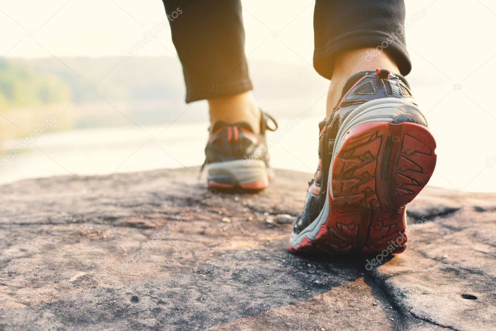 Feet women walking in nature background