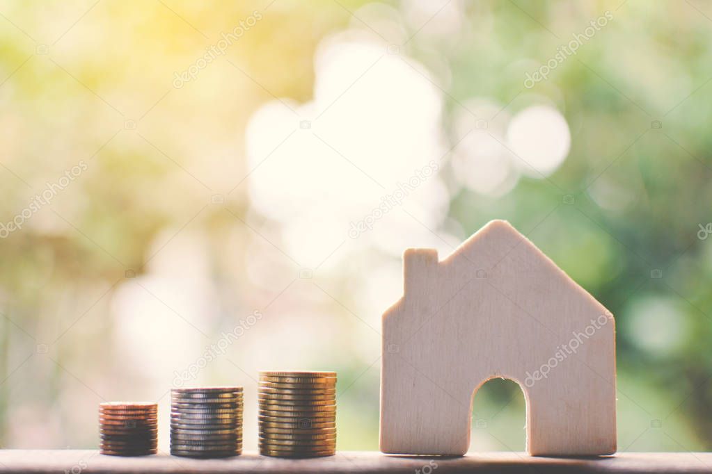 coins and wood house ,selective and soft focus vintage tone