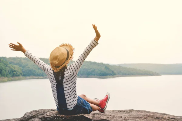 Happy Asian girl backpack in nature background — Stock Photo, Image