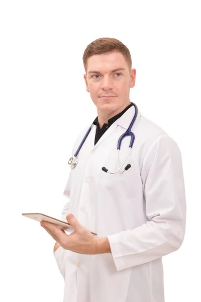 Portré, fiatal férfi orvos üzem tabletta fehér háttér — Stock Fotó