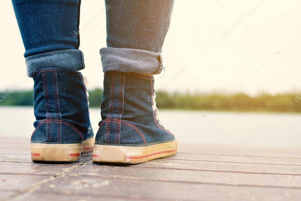 Feet of hipster women in park and nature background