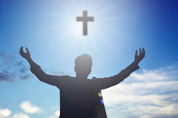 Silhouette of man open hands and cross — Stock Photo, Image