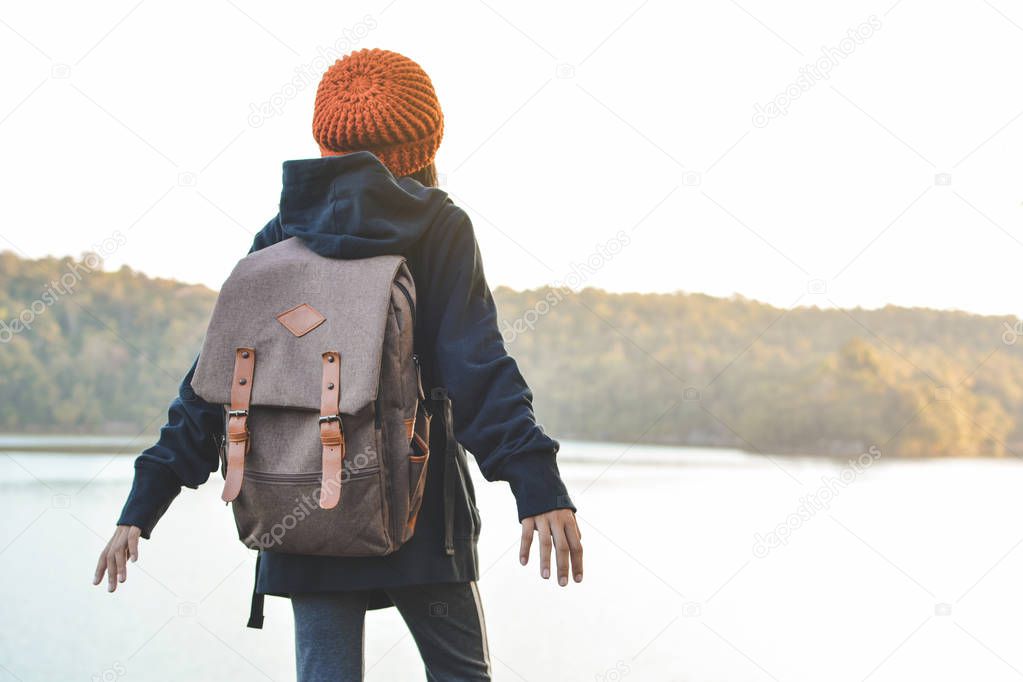 Asian girl backpack in nature winter season, Relax time on holiday concept travel,selective and soft focus,tone of hipster style