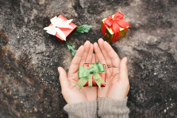 Female Hands Holding Gift Box Stone Christmas New Year Concept — Stock Photo, Image