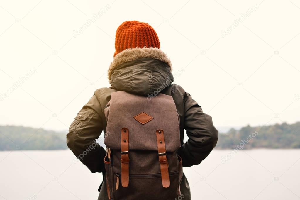 Asian boy backpack in nature winter season, Relax time on holiday concept travel,selective and soft focus,tone of hipster style