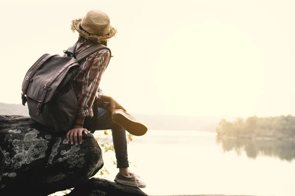 Asian girl backpack in nature , Relax time on holiday concept travel,selective and soft focus,tone of hipster style