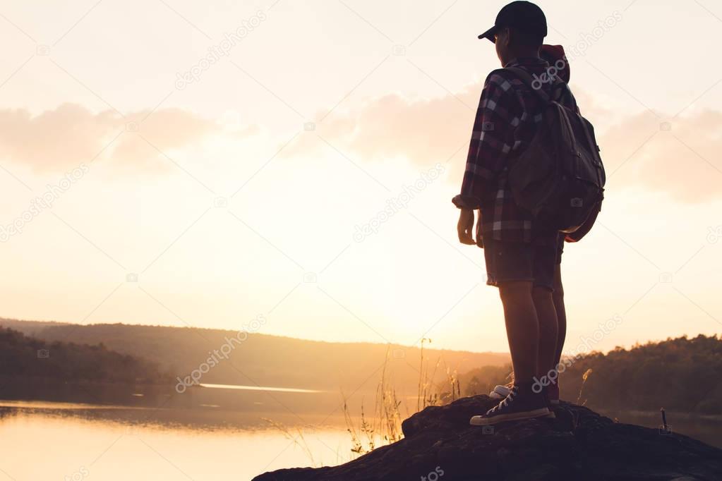 Silhouette of children backpack in nature , Relax time on holiday concept travel,selective and soft focus,tone of hipster style