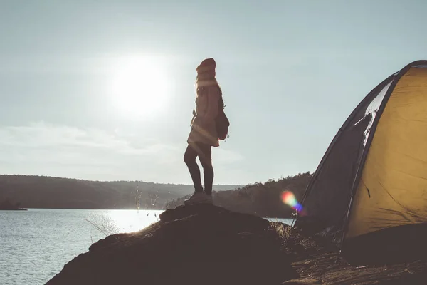 Silhouette Asian woman relax on holiday concept travel,selective and soft focus,tone of hipster style