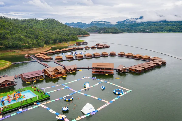 Aerial view, Wooden raft resort with waterpark in tropical fores