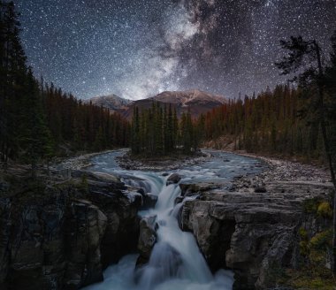 Sunwapta Falls with Milky way in autumn at Icefields Parkway, Ja clipart