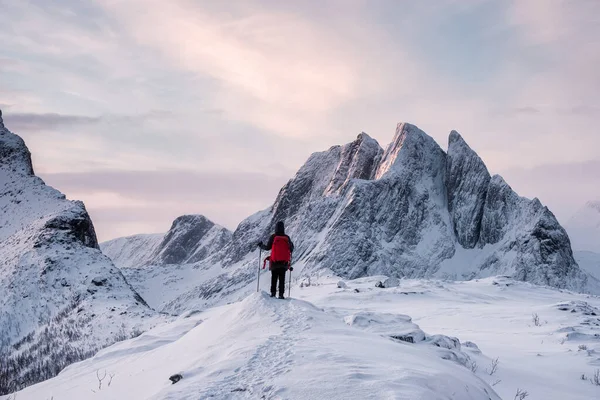 stock image Traveler standing with hiking poles on top of Segla mountain in 