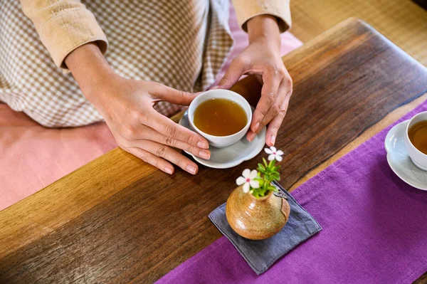 Female Hands Holding Hot Tea Wooden Table Morning — 스톡 사진