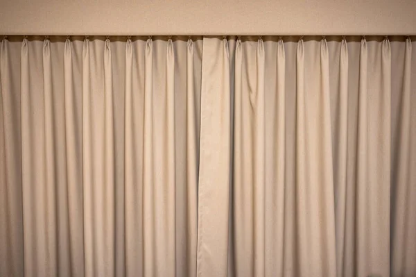 Closed brown velvet curtain wavy background