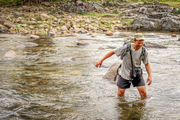 Crossing the river in tropics