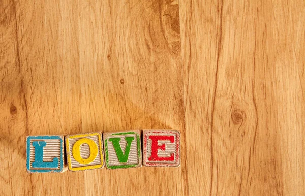 Dřevěná hračka bloky kouzlo lásky — Stock fotografie