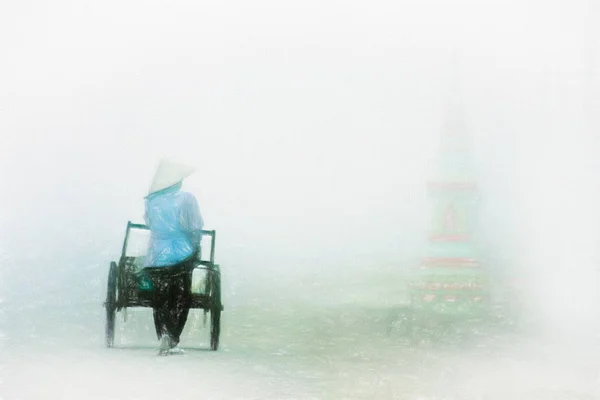 Lao woman walking in fog