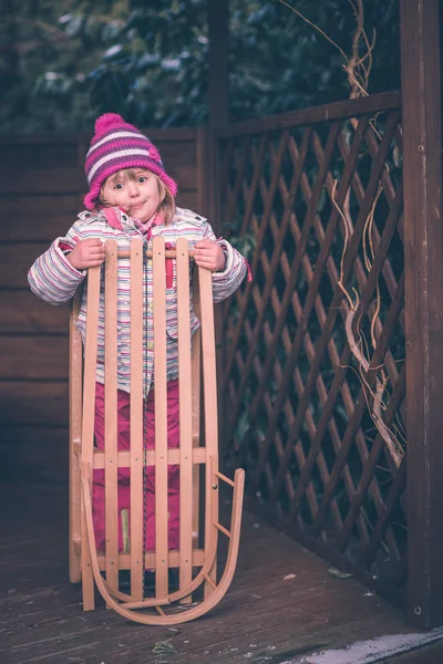 Girl with sled winter portrait — Stock Photo, Image