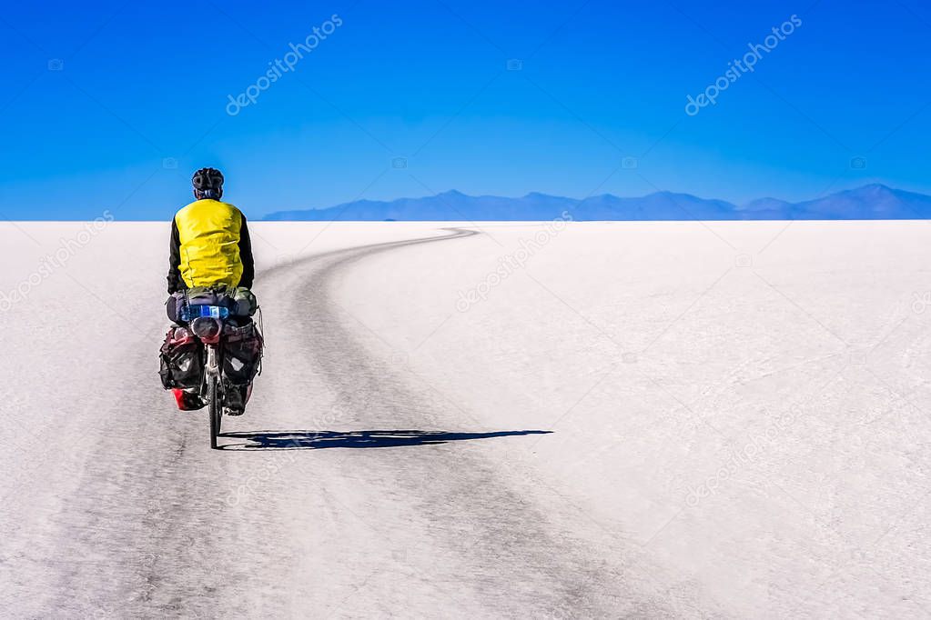 Cyclist travelling through the Salar de Uyuni 