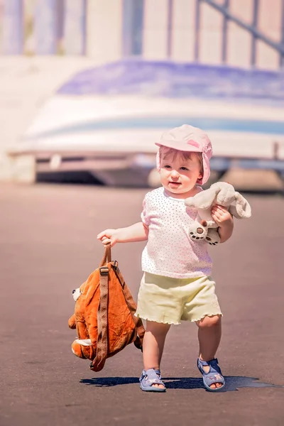 Little cute girl carrying her doggy backpack — Stock Photo, Image