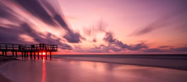 Sunset over wooden pier panorama — Stock Photo, Image
