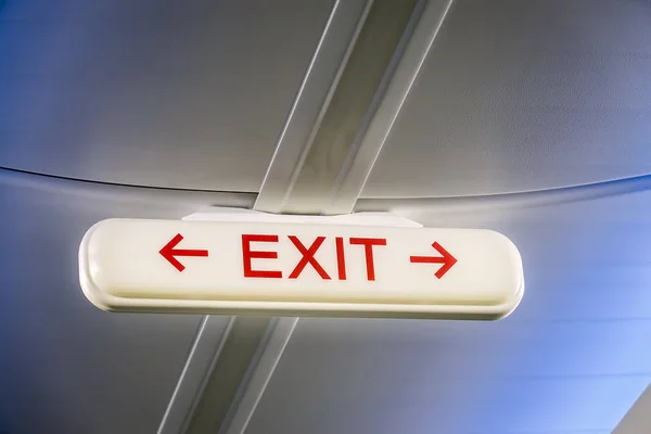 Emergency Exit Sign inside a plane — Stock Photo, Image