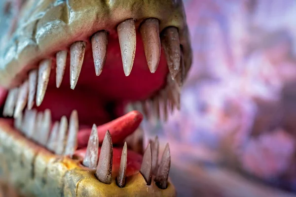 Open mouth of velociraptor dinosaur statue