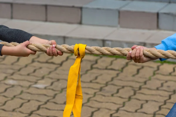 Children pulling rope