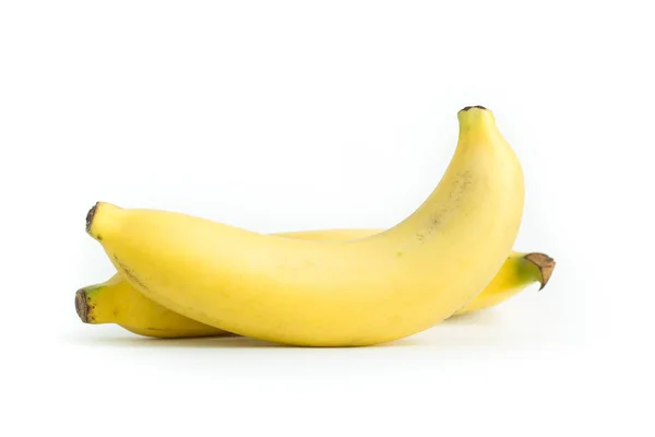 Золотой банан на белом фоне — стоковое фото