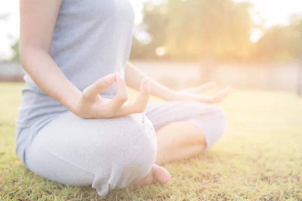 Close up hands woman do yoga,Asian girl doing yoga in garden — Stock Photo, Image