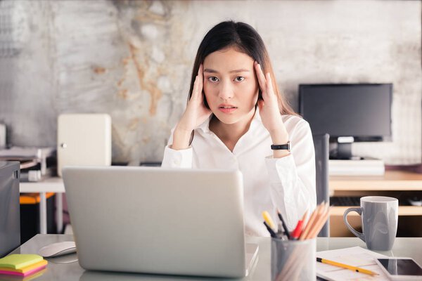 Young business people are suffering from headaches