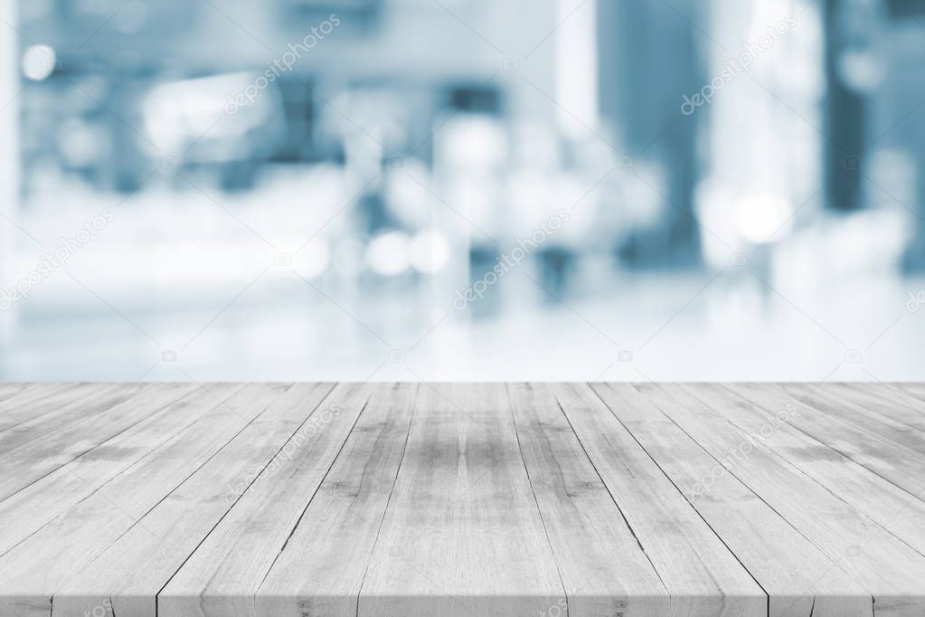 Empty white table top on blurred background from shopping mall