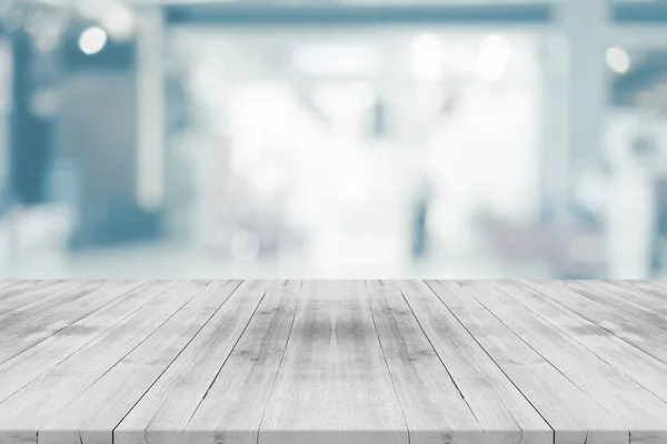 Empty white table top on blurred background from shopping mall — Stock Photo, Image