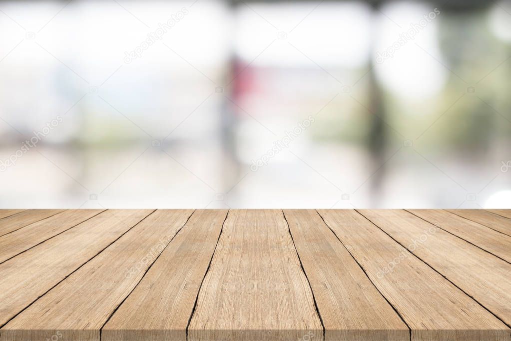 Empty wood table top on blurred background