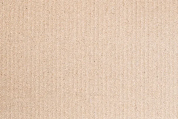 A caixa de papel marrom está vazia, a superfície ondulada do fundo abstrato . — Fotografia de Stock